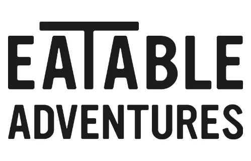 Logotipo "Eatable Adventures" en negrita.